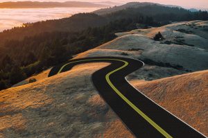 mountain landscape view of a winding road to represent pension plan