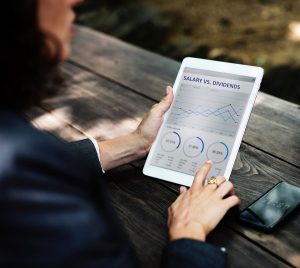 remuneration-concept-businesswoman-looking-at-tablet